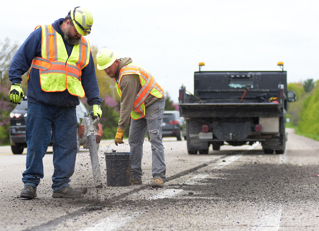 Municipal workers Adam Gaggens and Justin Kumberg